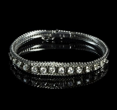 Lot 299 - An 18ct white gold and diamond bracelet, the...