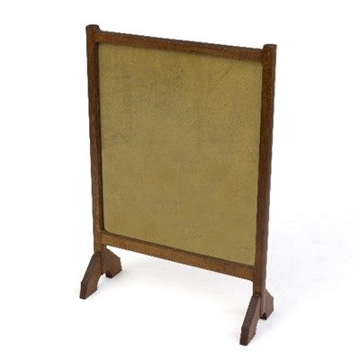 Lot 354 - A Cotswold School oak firescreen, in the...