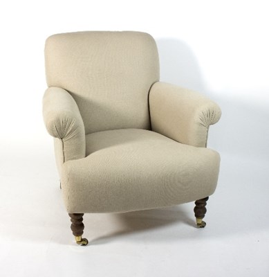 Lot 359 - A modern upholstered armchair on turned legs...