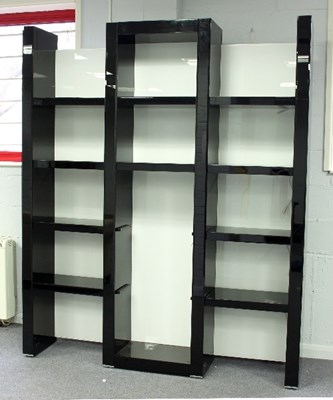 Lot 370 - A tall gloss black shelving unit, 218cm high x...