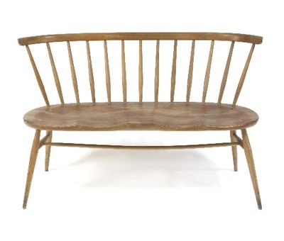 Lot 381 - An Ercol love seat, design 1943, with curved...