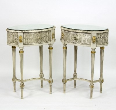 Lot 389 - A pair of painted oval bedside tables, each...