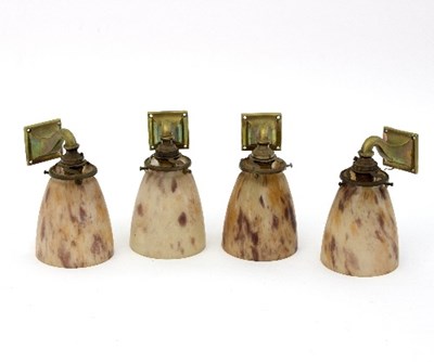 Lot 401 - A set of four Art Deco wall lights, the brass...