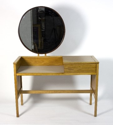 Lot 411 - G-Plan, a 1960s oak dressing table, mounted...