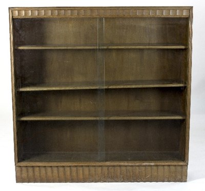 Lot 428 - An oak bookcase in the manner of Gordon...