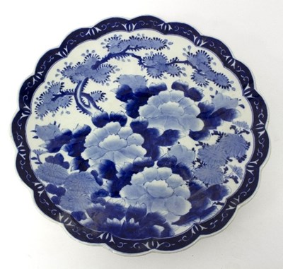 Lot 576 - A Japanese blue and white charger, decorated...