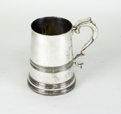 Lot 475 - A Georgian style plated tankard with glass...