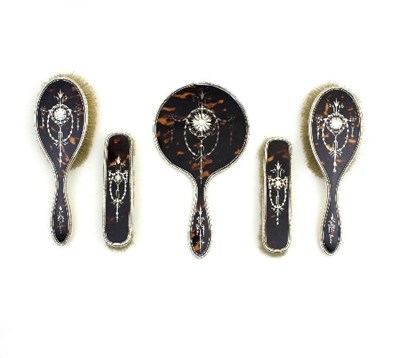 Lot 502 - A silver and tortoiseshell backed dressing...