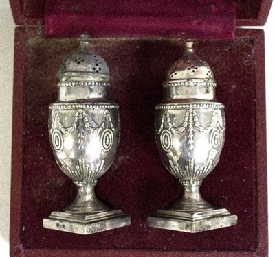 Lot 518 - A matched set of silver pepperettes in the...