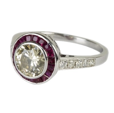 Lot 545 - A diamond and ruby dress ring, the central...