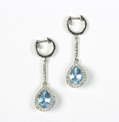 Lot 551 - A pair of topaz and diamond pendant earrings,...