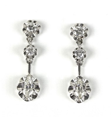 Lot 553 - A pair of diamond pendant earrings, each set...