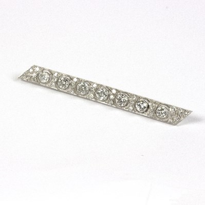 Lot 554 - An Art Deco diamond bar brooch, of seven...