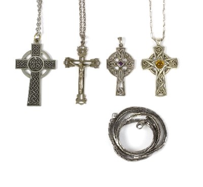 Lot 559 - A silver coloured metal crucifix and three...