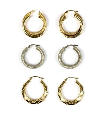 Lot 565 - A pair of 9ct gold hoop earrings with twisted,...