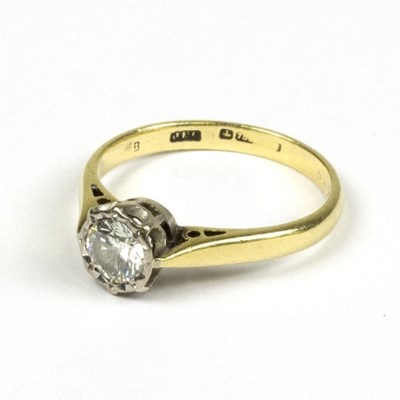 Lot 566 - A diamond solitaire ring to an 18ct gold band,...