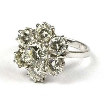 Lot 576 - A diamond seven-stone ring, the central stone...