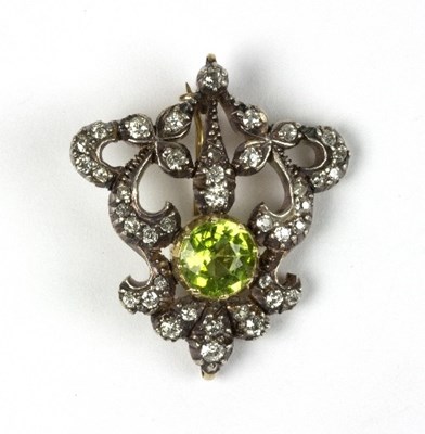 Lot 581 - A late Victorian peridot and diamond brooch of...