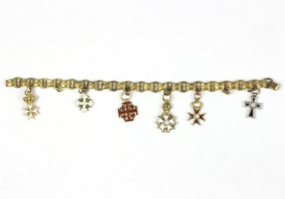 Lot 582 - A yellow metal bracelet hung with six enamel...