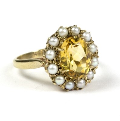 Lot 592 - A citrine and seed pearl cluster ring, in a...