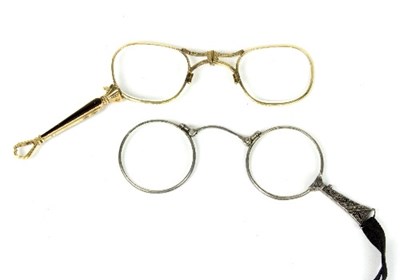 Lot 611 - A pair of French yellow metal lorgnettes and...