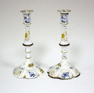 Lot 612 - A pair of Bilston enamel candlesticks, painted...