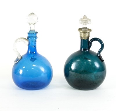 Lot 638 - Two coloured glass claret bottles, both with...