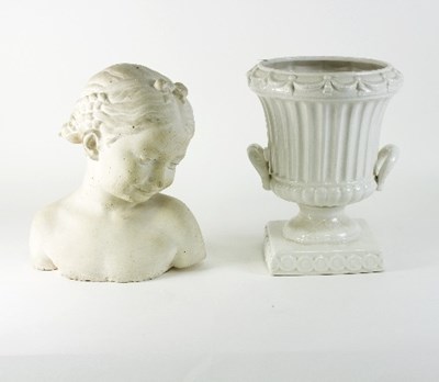 Lot 657 - A large white glazed pottery urn and a plaster...