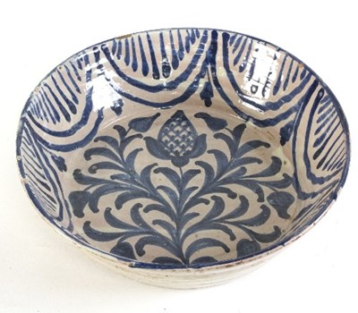 Lot 682 - A Spanish pottery bowl, circular with foliate...