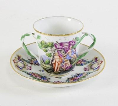 Lot 687 - A Continental two-handled cup and saucer,...