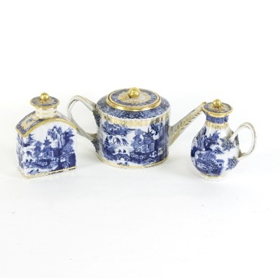 Lot 695 - A Chinese export blue and white teapot, cream...