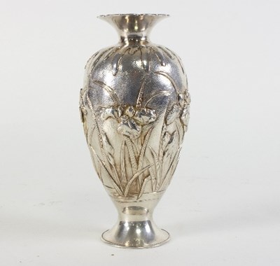 Lot 702 - A Chinese white metal vase decorated iris...