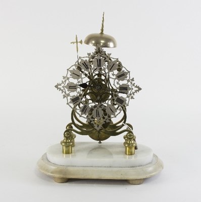 Lot 710 - A Victorian brass eight-day skeleton clock...