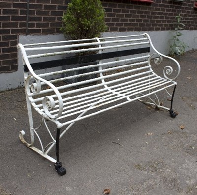 Lot 751 - A white painted wrought iron railway seat with...