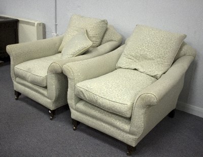 Lot 765 - A pair of upholstered low back armchairs on...