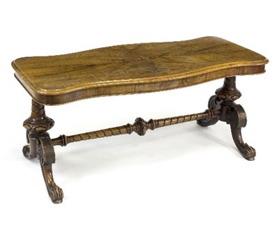 Lot 784 - A walnut low occasional table, with shaped top,...