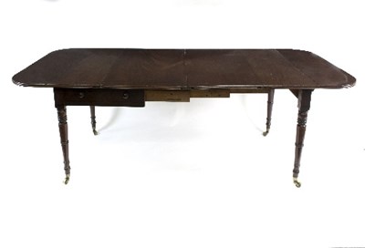 Lot 796 - A Regency mahogany concertina extending table,...