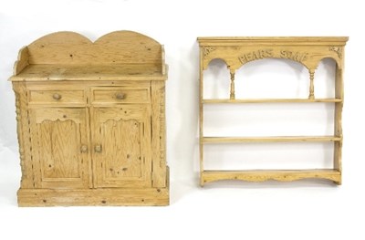 Lot 815 - A pine two-door cupboard with later shaped...