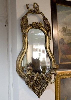 Lot 823 - A gilded girandole mirror moulded with wheat...