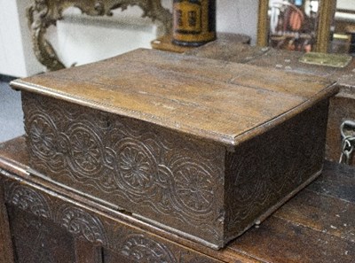 Lot 831 - A 17th Century oak Bible box, the sides carved...