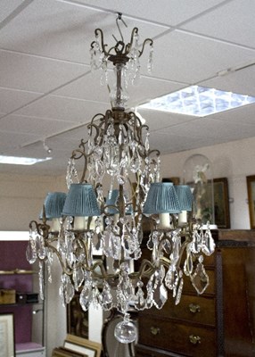 Lot 834 - A ten-branch five-light chandelier hung with...