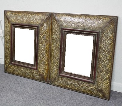 Lot 838 - A pair of modern wall mirrors with embossed...