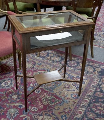 Lot 843 - A mahogany and inlaid vitrine, on square...