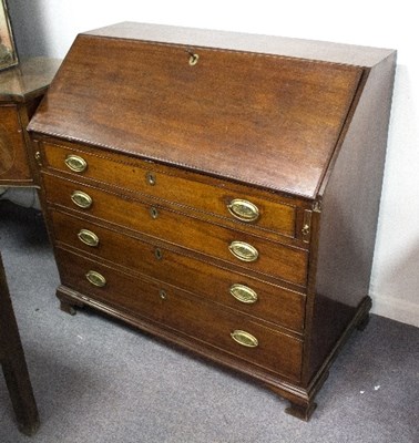 Lot 854 - A George III mahogany bureau with fitted...