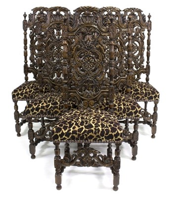 Lot 872 - Six Carolean style carved oak chairs, the...