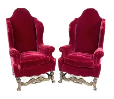 Lot 874 - A pair of high wing back armchairs with scroll...