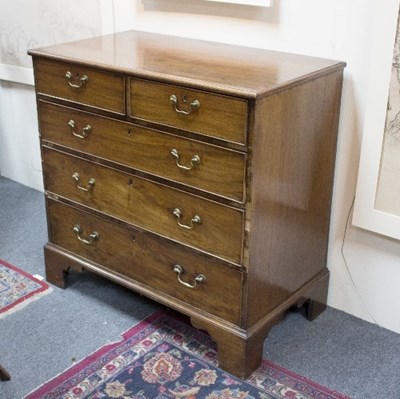 Lot 895 - A George III mahogany chest of three long and...