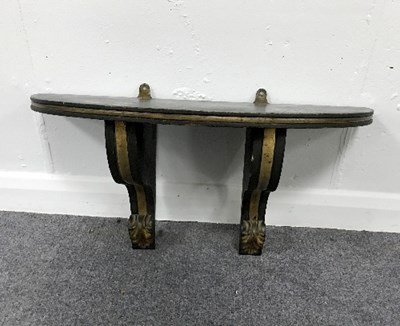 Lot 909 - A half-round wall bracket