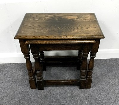 Lot 911 - A nest of two oak tables, 48cm wide