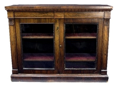 Lot 923 - A Regency rosewood side cabinet, the top with...